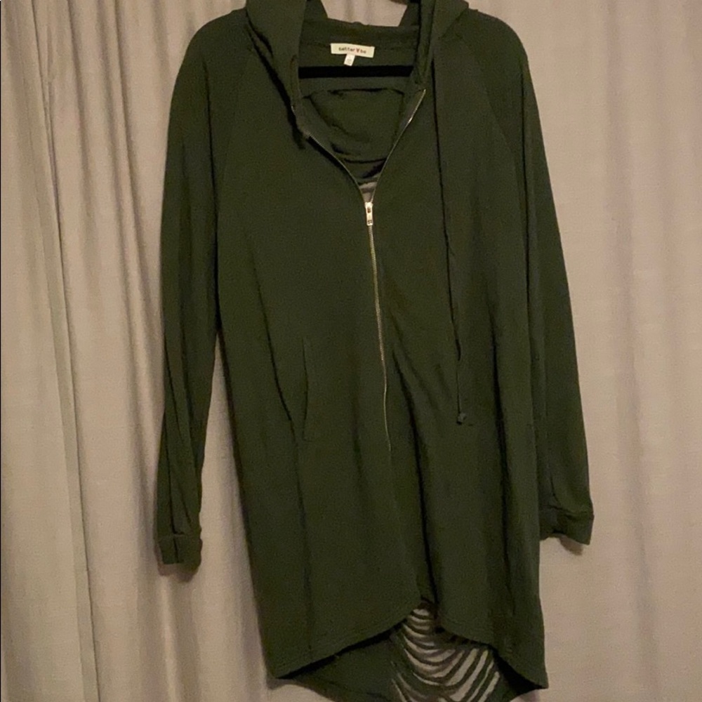 Green sweatshirt with ripped back